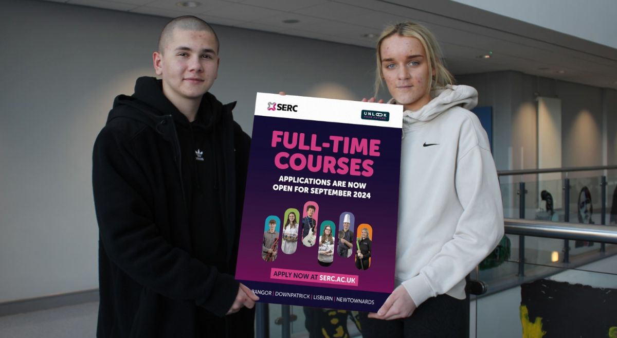 Picture of two SERC students holding a SERC Full-Time Courses graphic